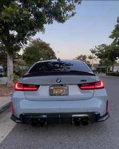 the back end of a silver bmw car