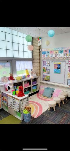 a child's playroom with toys and bookshelves