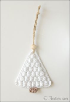 a white ornament hanging from a string