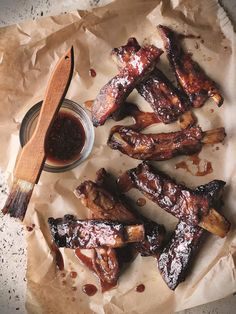 barbecued ribs with bbq sauce on parchment paper