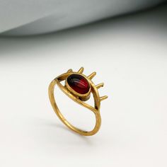 Garnet Evil Eye Ring, Natural Garnet Gemstone Handmade Gold Evil Eye Ring, Evil Eye Jewelry Statement Eye Ring For Birthday. Size:- Any Material:- Brass Stone:- garnet The ring can be customized on request and the gemstone can be made into any gem you want. The same Design Ring Is Upload With Any Gemstone. Please Visit Our Shop to View Complete Collection. If You Need Faster Shipping, Please Contact us ♥Please Make Sure to Include The Correct Address During Before Ordering. You Can return the It Unique Jeweled Rings For Gift, Adjustable Jeweled Ring For Gifts, Adjustable Jeweled Ring Perfect As A Gift, Adjustable Rings With Jewels For Gift, Crystal Open Ring With Jewels For Gifts, Metal Crystal Ring For Gift, Open Crystal Ring With Jewels For Gift, Gift Crystal Open Ring With Jewels, Handmade Crystal Metal Ring As Gift