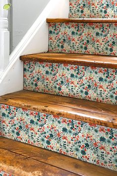 the stairs are decorated with floral wallpaper