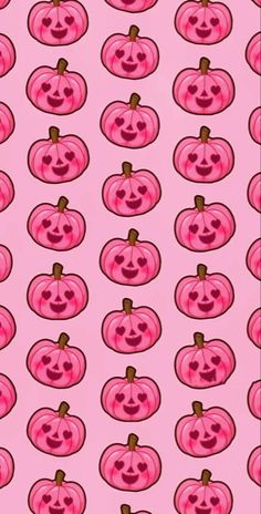 a pink background with pumpkins and faces on it