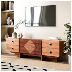 an entertainment center with two drawers and a flat screen tv mounted on the wall