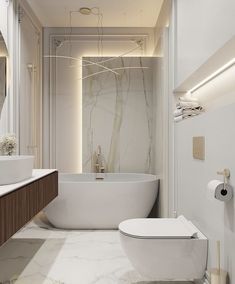 a bathroom with a large white tub sitting next to a toilet