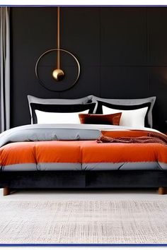 a bed with an orange and grey comforter in a bedroom next to a window