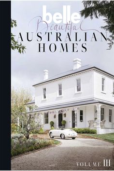 the front cover of an australian house with a white car parked in front of it