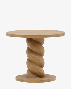 a round wooden table with three spirals on it's legs and one end