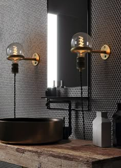 a bathroom with two lights on the wall and a round sink in front of it