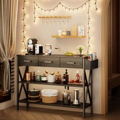 a shelf with various items on it in front of a window filled with christmas lights