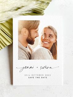 a wedding save the date card with an image of a man and woman on it