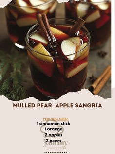 an advertisement for mulled pear apple sangria with cinnamon sticks and apples in it