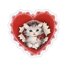 a small kitten sitting in the middle of a heart shaped sticker with an image of a