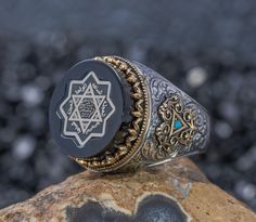 a ring sitting on top of a rock