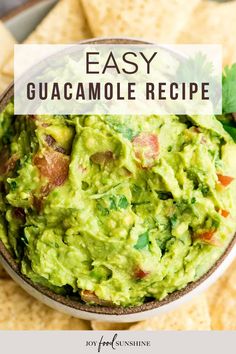 a bowl filled with guacamole surrounded by tortilla chips