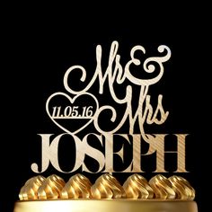 a wedding cake topper with the words mr and mrs joseph written in white on it