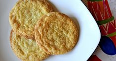 three cookies are on a white plate