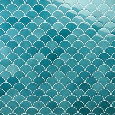 an abstract blue and white background with wavy lines in the shape of fish scale scales