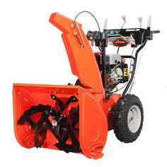 an orange snow blower sitting on top of a white background