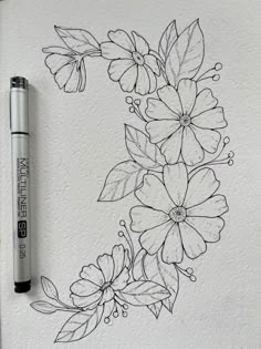 a pencil drawing of flowers and leaves on white paper with a marker next to it