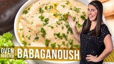 a woman standing in front of a bowl of food with the words oven roasted babaganoushh on it