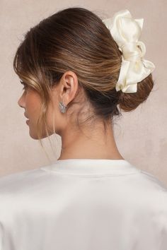 When our look needs a lovely finish, we always reach for the Lulus Sleek Conclusion Ivory Bow Claw Hair Clip! This totally chic hair accessory boasts a classic claw clip silhouette with a satin, tiered bow detail at either side, perfect for making any hairdo effortlessly elegant. Interlocking claws and a gold hinge closure will make sure to keep your gorgeous locks secured! 6" long. 90% Polyester, 10% Iron. Imported. Lulus | Sleek Conclusion Ivory Bow Claw Hair Clip. Pearl Bridal Comb, Chic Hair, 2025 Wedding, Bridal Comb, Double Bow, Kate Bosworth, Claw Hair Clips, Hair Claw Clip, Pearl Bridal