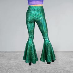 Holographic Green Mermaid Bell Bottoms High-Waisted style with 34" inseam Perfectly fitted and flattering to your body High-quality 4-way stretch holo spandex Handmade in the USA Made of stretchy metallic mermaid scale print in green - these high-waisted mermaid bell bottoms will fit you perfectly. They hug your hips and flare out at the feet. This color is stunning! The inseam is 34" and can be customized by specifying in the personalization box. *Our model typically wears a size 4, has a 27" w Green Fitted High Waist Bottoms, Fitted High Waist Green Bottoms, Green High Waist Fitted Bottoms, High Waist Fitted Green Bottoms, Fitted Full Length Green Bottoms, Fitted Full-length Green Bottoms, Green Fitted Flare Bottoms, Fitted Flare Green Bottoms, Fitted Flare Bottoms In Green