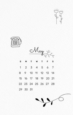 a calendar with the word may written in black and white on it, next to a flower