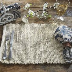 a place mat with silverware and napkins on it