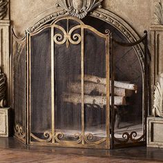 an ornate fireplace screen in the corner of a room