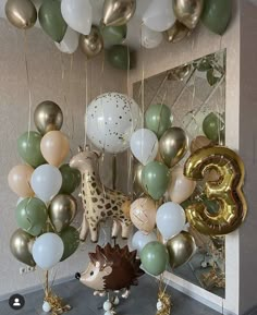 a room filled with lots of balloons and animals