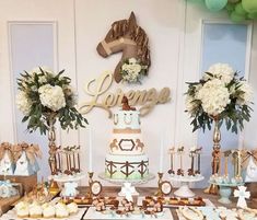 a table topped with lots of cakes and desserts