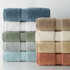 towels stacked on top of each other in different colors