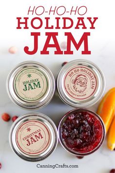 four jars of jam sitting next to an orange