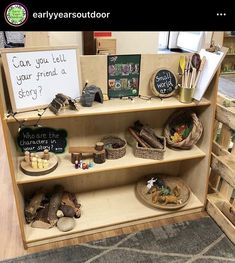 a book shelf with many items on it and a sign that says can you tell your friend a story?