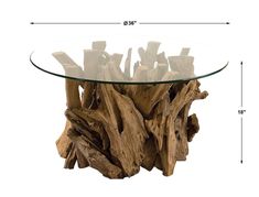 a glass table topped with driftwood pieces