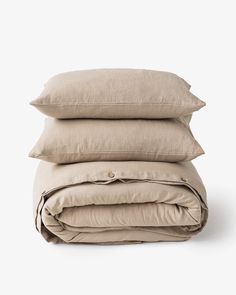 three pillows stacked on top of each other