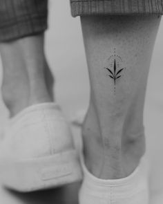 a person with a small tattoo on their foot