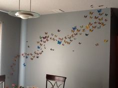 a dining room with butterflies on the wall