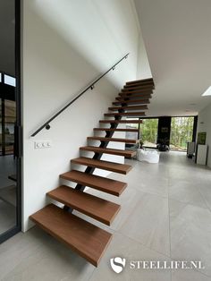 the stairs are made of wood and have metal handrails