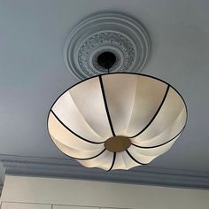 a light fixture hanging from the ceiling in a room