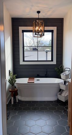 a white bath tub sitting next to a window