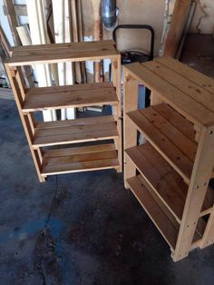 two wooden shelves sitting next to each other on top of a floor in a garage