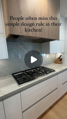 a kitchen with white cabinets and marble counter tops that says people often miss this simple design rule in their kitchen