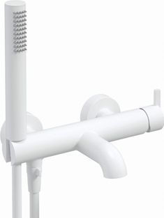 a white faucet mounted to the side of a wall with a toothbrush in it