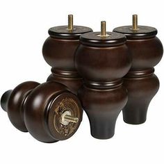 four brown ceramic vases with brass knobs and screws on each one side