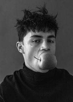 black and white photograph of man with nose ring