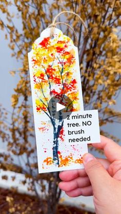 someone is holding up a card with an image of a tree and the words minute train no brush needed