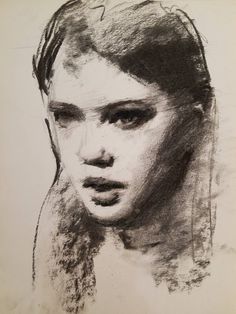 a black and white drawing of a woman's face