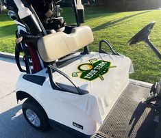 a white golf cart with the word boston university on it